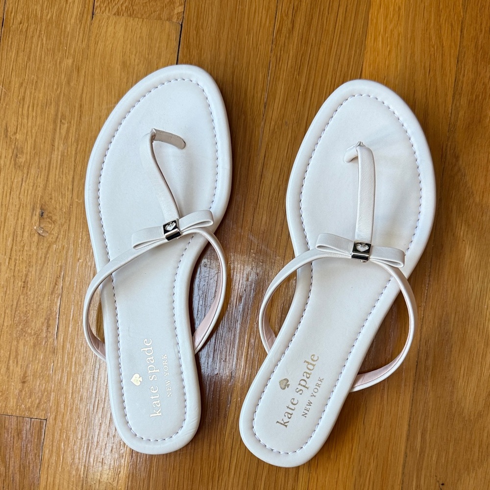 Brand new Kate Spade Cream Sandals with Sleek Straps and bow